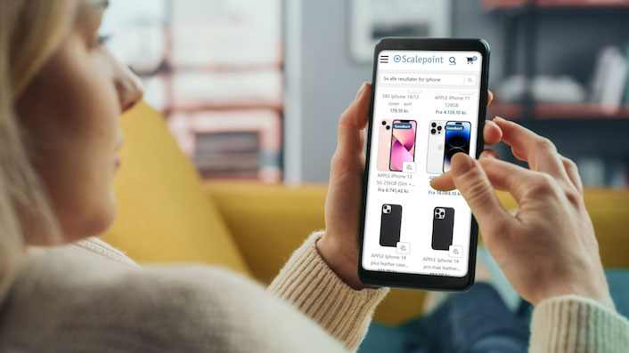 claimshop-settlement-productcatalog_706x397 Girl looking through ClaimShop product catalog on phone