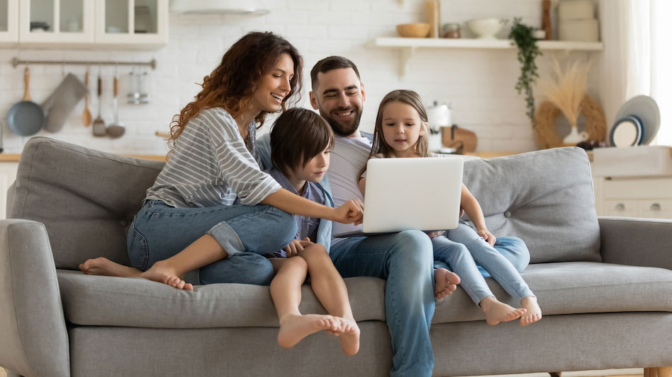 news-stolen-jewels-lead-to-a-new-sofa_948x533 Family sitting on couch looking at computer