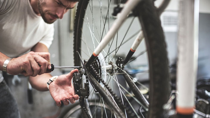 Man repairing bike