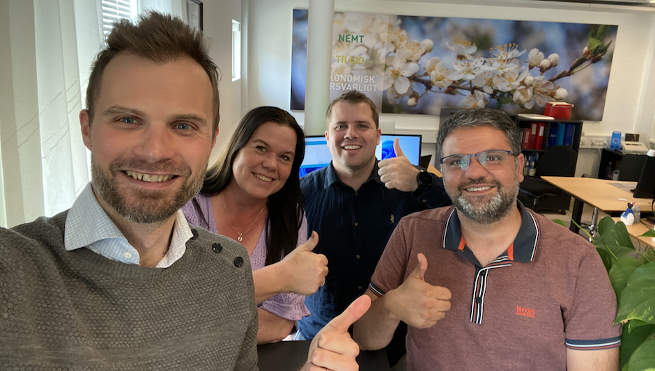 Scalepoint medarbejder sammen med tre medarbejdere fra Gartnernes Forsikring
